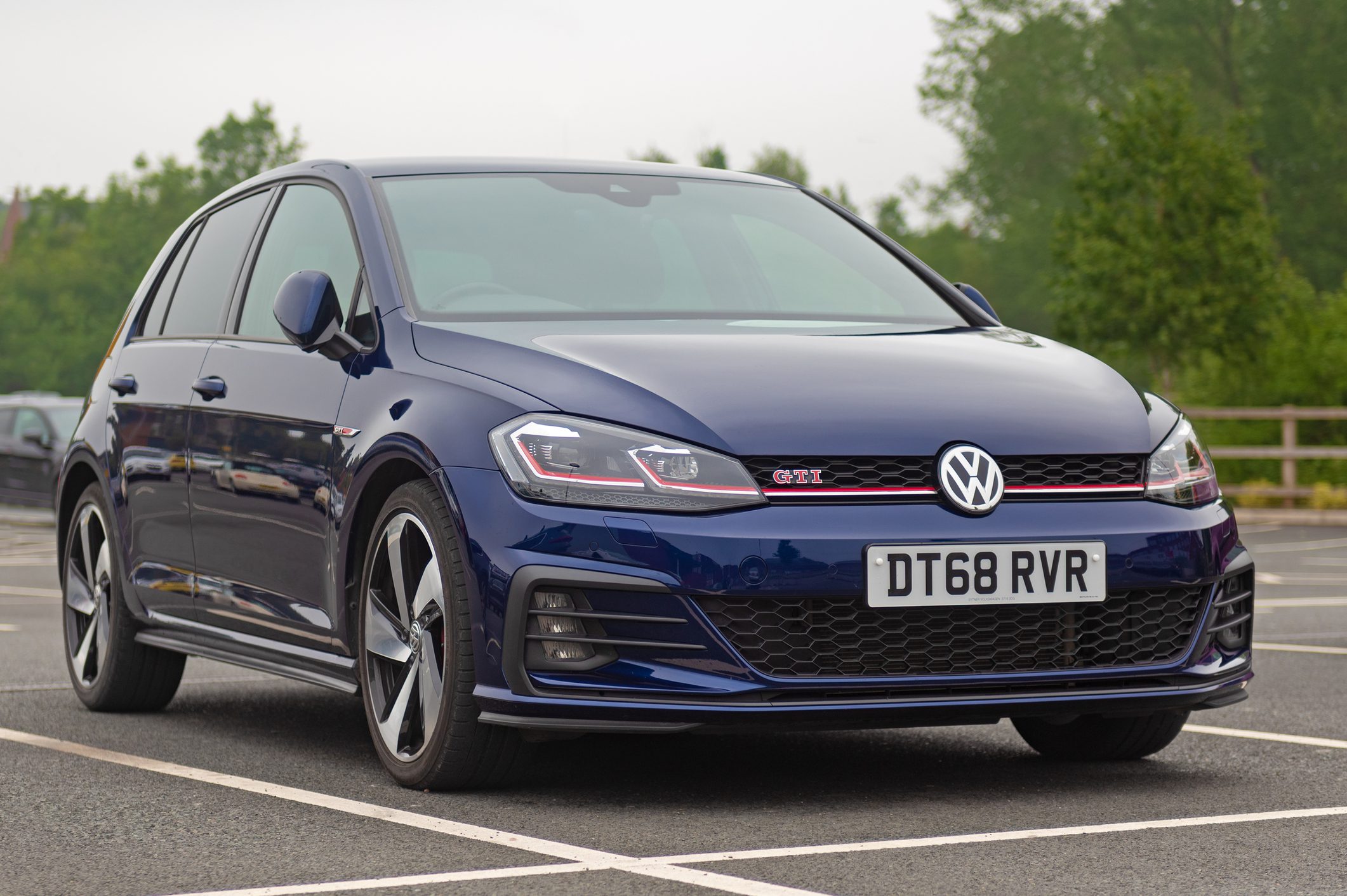 Volkswagen Golf GTI MK 7 car stationary in car park.