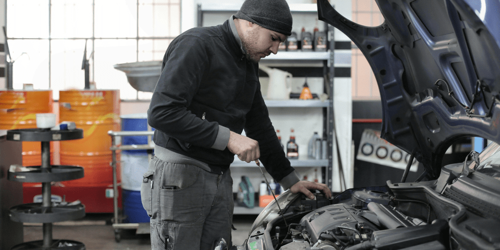 Mechanic working on a car service.